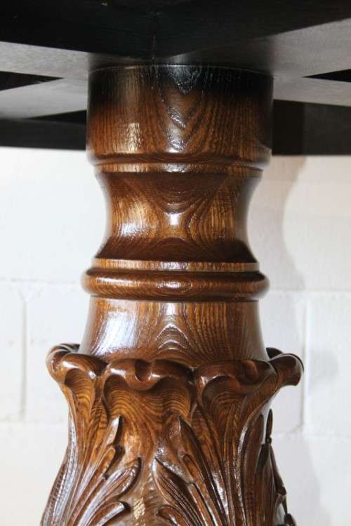 A very well made and heavy oak dining table w/ a wonderfully carved centre leg