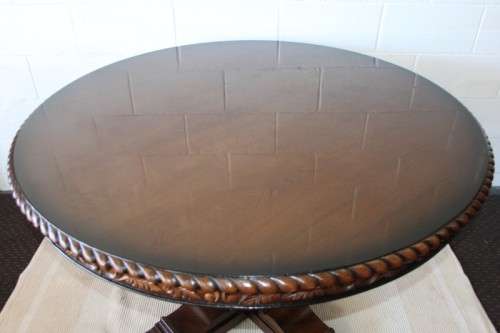 A very well made and heavy oak dining table w/ a wonderfully carved centre leg
