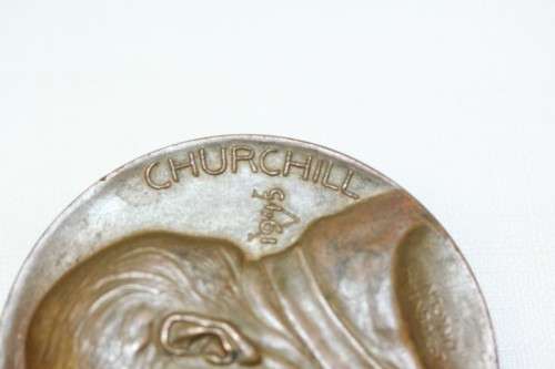 An original 1945 Winston Churchill bronze Victory Medal commemorating the end of World War II