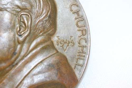 An original 1945 Winston Churchill bronze Victory Medal commemorating the end of World War II