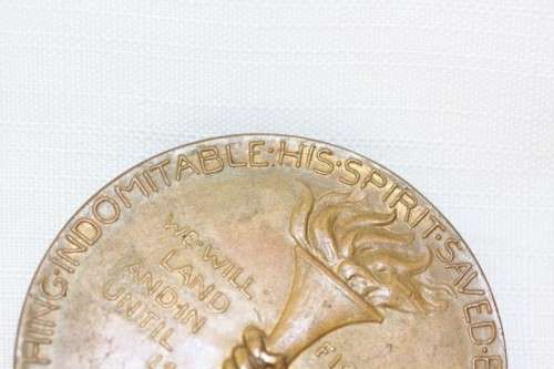 An original 1945 Winston Churchill bronze Victory Medal commemorating the end of World War II