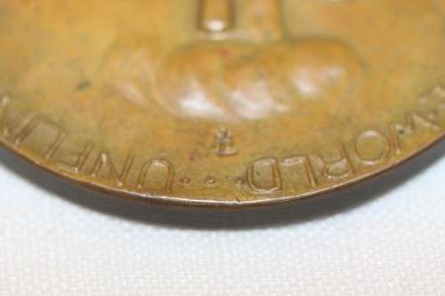 An original 1945 Winston Churchill bronze Victory Medal commemorating the end of World War II