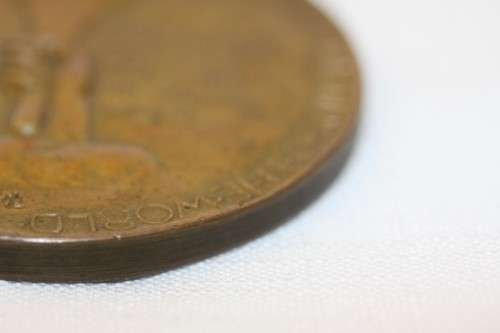 An original 1945 Winston Churchill bronze Victory Medal commemorating the end of World War II