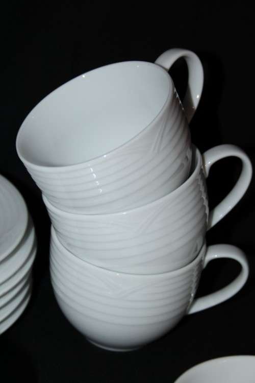 A set of Noritake "Arctic White" porcelain - 7 cups and 8 saucers in amazing condition