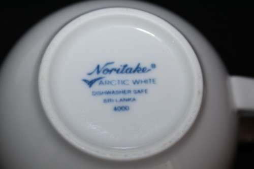 A set of Noritake "Arctic White" porcelain - 7 cups and 8 saucers in amazing condition