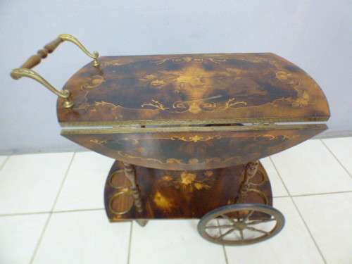 An exquisite Italian Sorrento style wood antique drinks trolley on original castors and wheels.