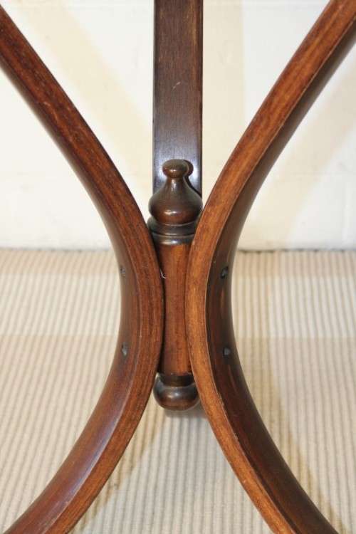 A stunning wicker-top occasional table with bentwood legs, something different in your home