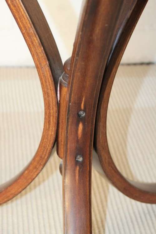 A stunning wicker-top occasional table with bentwood legs, something different in your home