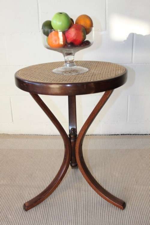 A stunning wicker-top occasional table with bentwood legs, something different in your home