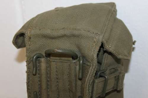 A vintage olive green military water bottle carry bag in very good condition