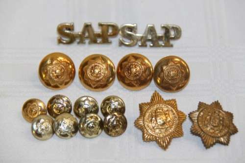 A stunning large collection of South African Police buttons and badges including "SAP" badges