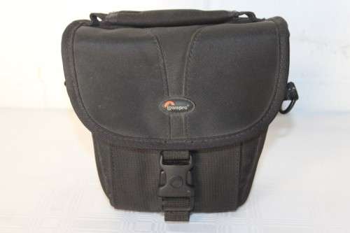 A Fujifilm FinePix S5000 Zoom with a strap in a high quality Lowepro bag