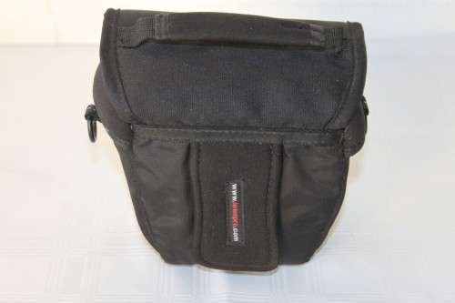A Fujifilm FinePix S5000 Zoom with a strap in a high quality Lowepro bag