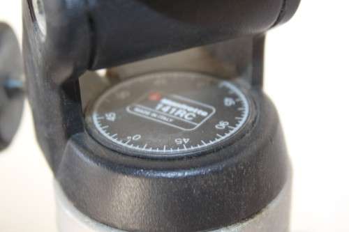 A durable and good quality Manfrotto 190D tripod with a strap in the original box