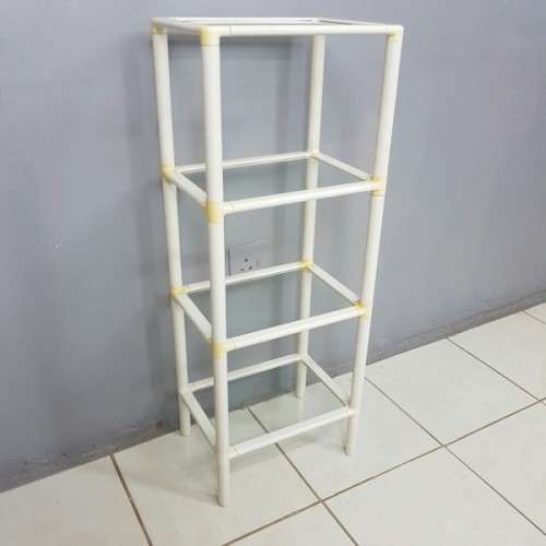 A fabulous 4-tier multi-purpose glass shelf display stand in good condition