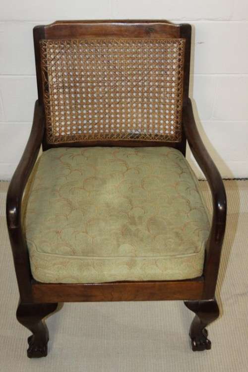 An amazing vintage solid Imbuia "Wicker Back" ball & claw occasional chair