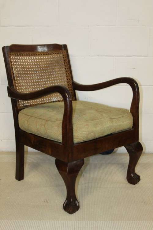 An amazing vintage solid Imbuia "Wicker Back" ball & claw occasional chair