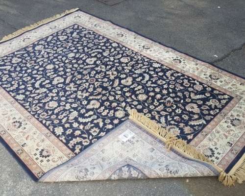 A superb Saudi made navy blue "silky" carpet with a stunning pattern in awesome condition
