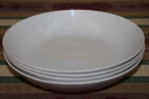 An assortment of plastic plates and bowls - perfect to take on camping trips
