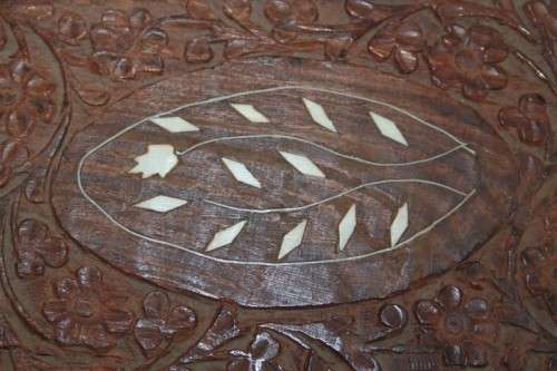 A beautiful hand carved wooden playing card/ storage box with lovely detailing on it