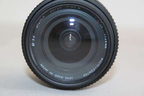 **RS17** A Sigma (for Minolta) Super-Wide II macro lens with its protective casing and lens hood
