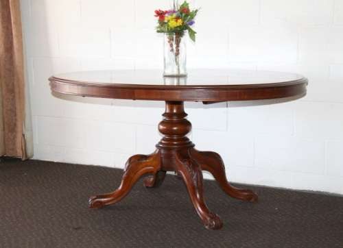 A magnificent antique carved oval Georgian Rosewood "tilt top" hall table in spectacular condition!