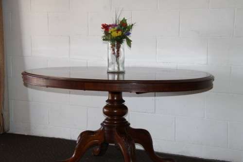 A magnificent antique carved oval Georgian Rosewood "tilt top" hall table in spectacular condition!