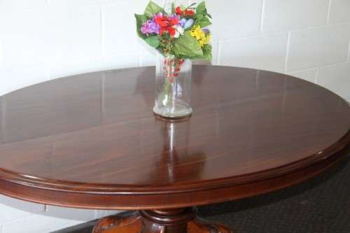 A magnificent antique carved oval Georgian Rosewood "tilt top" hall table in spectacular condition!