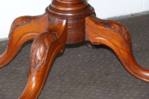 A magnificent antique carved oval Georgian Rosewood "tilt top" hall table in spectacular condition!