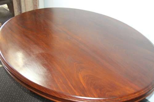 A magnificent antique carved oval Georgian Rosewood "tilt top" hall table in spectacular condition!