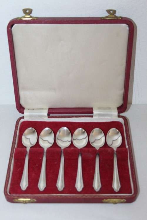 An exquisite vintage (c.1960) boxed set of six solid silver hallmarked demitasse spoons