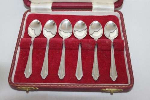 An exquisite vintage (c.1960) boxed set of six solid silver hallmarked demitasse spoons