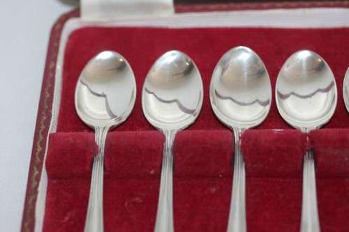 An exquisite vintage (c.1960) boxed set of six solid silver hallmarked demitasse spoons