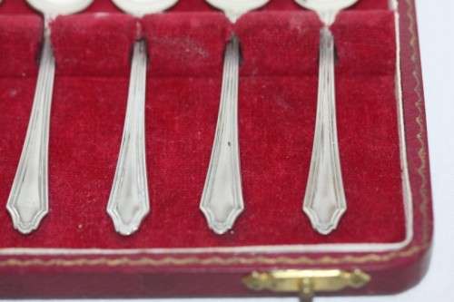 An exquisite vintage (c.1960) boxed set of six solid silver hallmarked demitasse spoons