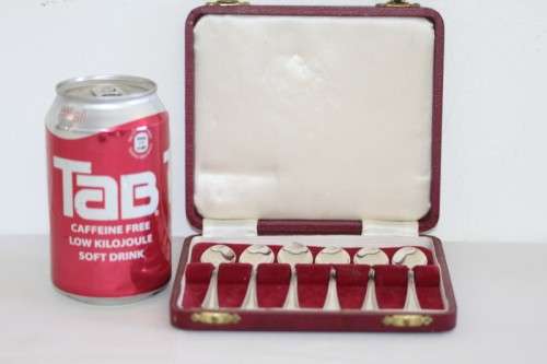 An exquisite vintage (c.1960) boxed set of six solid silver hallmarked demitasse spoons