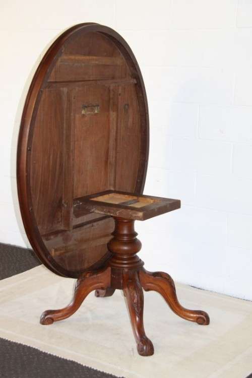 A magnificent antique carved oval Georgian Rosewood "tilt top" hall table in spectacular condition!