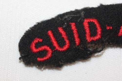 A military black and red "Suid-Afrika" patch in good condition