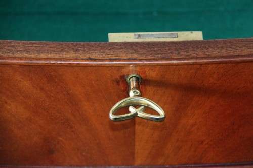A magnificent Kingswood finished Regency buffet/ side server with spade feet and a curved front