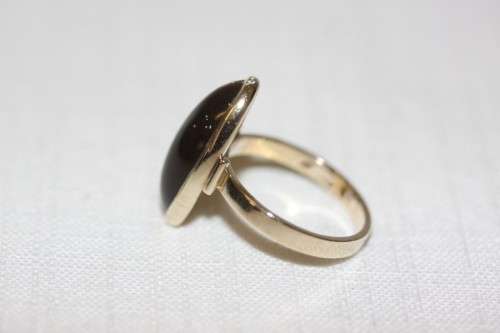 An exquisite vintage 9ct yellow gold ladies "oval" setting tigers eye ring by Birger Haglund