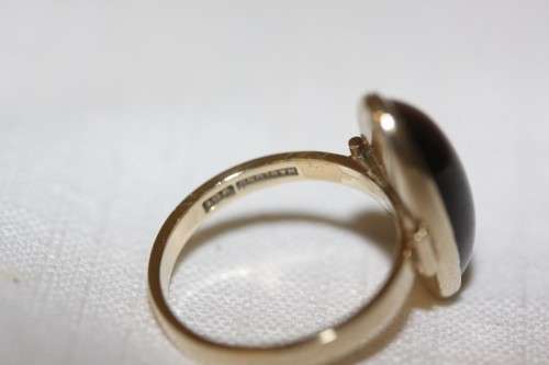 An exquisite vintage 9ct yellow gold ladies "oval" setting tigers eye ring by Birger Haglund