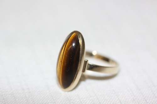 An exquisite vintage 9ct yellow gold ladies "oval" setting tigers eye ring by Birger Haglund