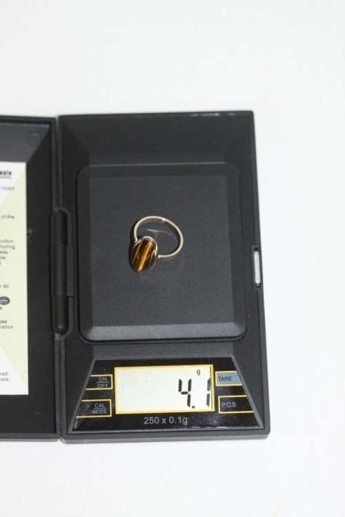 An exquisite vintage 9ct yellow gold ladies "oval" setting tigers eye ring by Birger Haglund