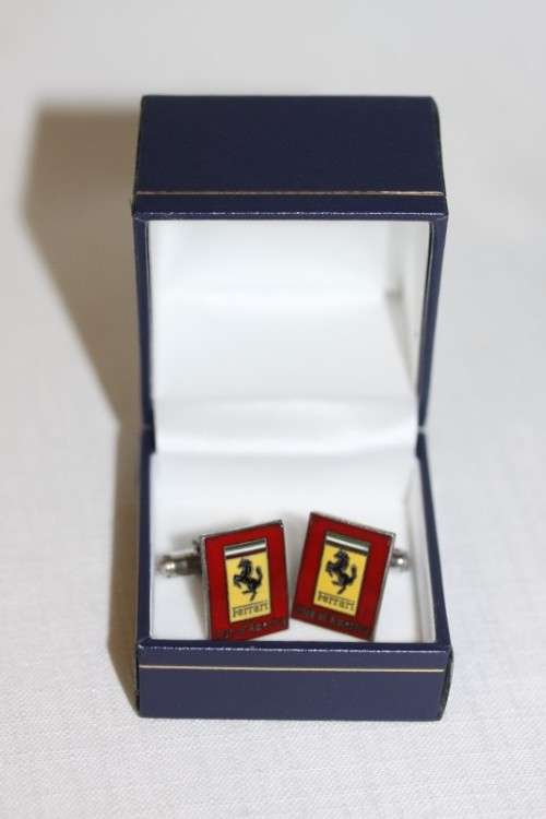 An extremely rare set of vintage (c1960's) Ferrari Club of America silver metal enamelled cuff-links