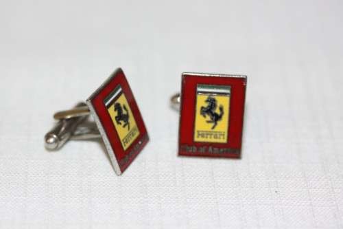 An extremely rare set of vintage (c1960's) Ferrari Club of America silver metal enamelled cuff-links