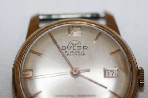 An incredible vintage Swiss made 21 Jewell "Buler" Calendar Nivarox Gents gold plated watch