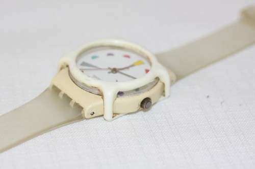 An amazing vintage (1980's) Uni-sex Swiss made Swatch "Tutti Frutti" watch with a watch guard cover