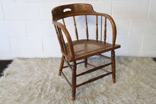 A magnificent Edwardian antique solid oak tub chair with a wicker bottom - very collectable!