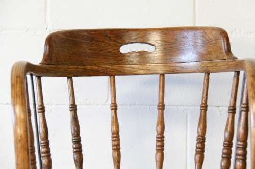 A magnificent Edwardian antique solid oak tub chair with a wicker bottom - very collectable!