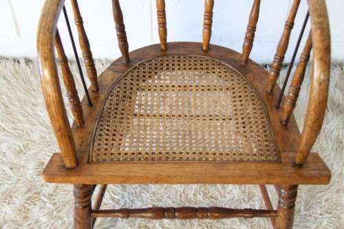 A magnificent Edwardian antique solid oak tub chair with a wicker bottom - very collectable!