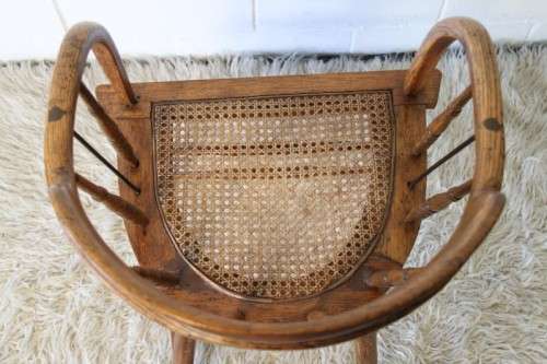 A magnificent Edwardian antique solid oak tub chair with a wicker bottom - very collectable!